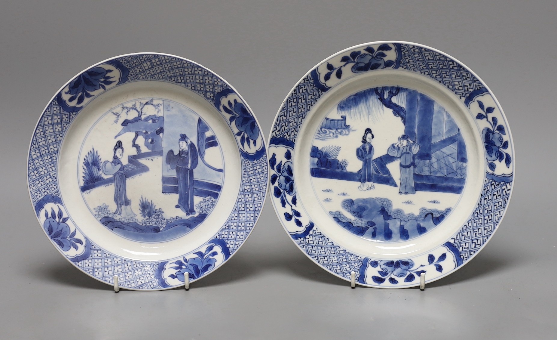 Two Chinese blue and white plates, Kangxi period, one with Kangxi mark the other a Chenghua mark, 21 cms diameter